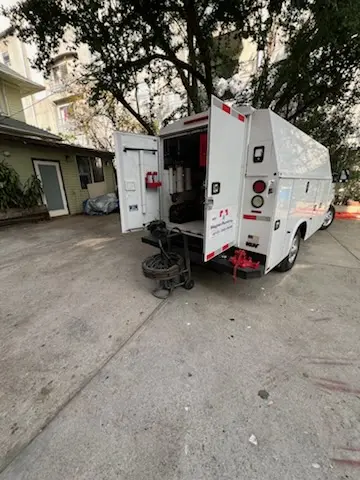 Magnet Plumbing service vehicle on-site for Grease Trap Cleaning in Live Oak Park